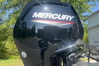 Slide: The Image of Mercury outboard motor on 2026 Sun Tracker Party Barge 18 DLX, outdoors. - 8