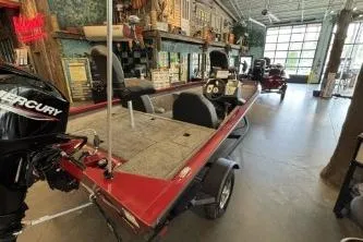 Slide: The Image of 2026 Tracker Pro Team 175 boat in showroom with Mercury engine. - 3
