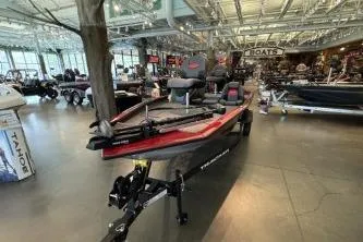 Slide: The Image of 2026 Tracker Pro Team 175 boat displayed in a showroom with modern interior. - 2