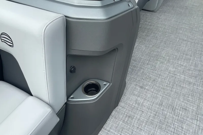 Slide: The Image of 2026 Sun Tracker Party Barge 24 XP3 interior with cup holder and seating detail. - 22