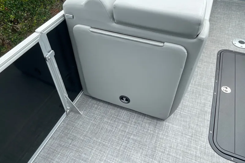 Slide: The Image of 2026 Sun Tracker Party Barge 24 XP3 interior with gray seating and flooring. - 23