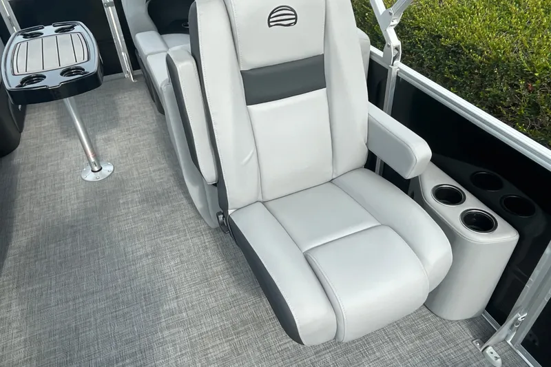 Slide: The Image of 2026 Sun Tracker Party Barge 24 XP3 interior with plush seating and cup holders. - 15