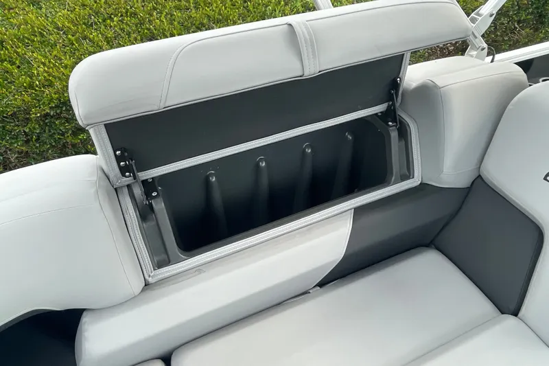 Slide: The Image of 2026 Sun Tracker Party Barge 24 XP3 seat storage compartment, open and empty. - 26