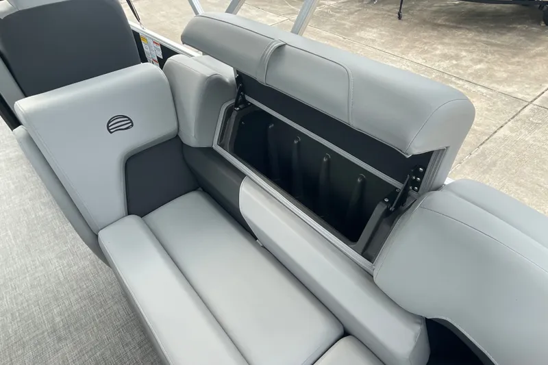 Slide: The Image of 2026 Sun Tracker Party Barge 24 XP3, featuring sleek gray seating with storage compartment. - 29
