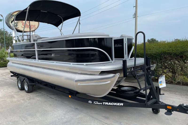Slide: The Image of 2026 Sun Tracker Party Barge 24 XP3 pontoon boat on trailer, ready for adventure. - 6