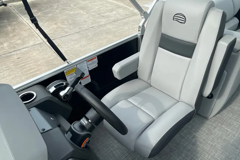 Slide: The Image of 2026 Sun Tracker Party Barge 24 XP3 captain's chair and control panel, featuring sleek design. - 10