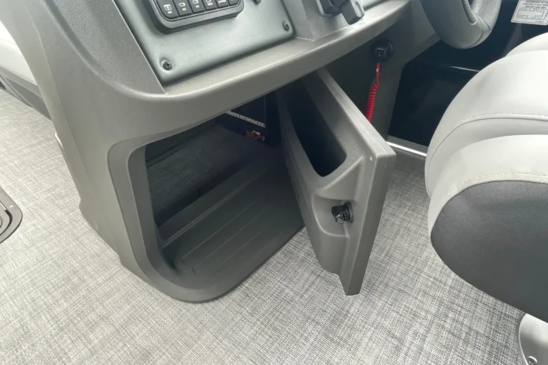 Slide: The Image of Open storage compartment in 2026 Sun Tracker Party Barge 24 XP3 boat interior. - 14