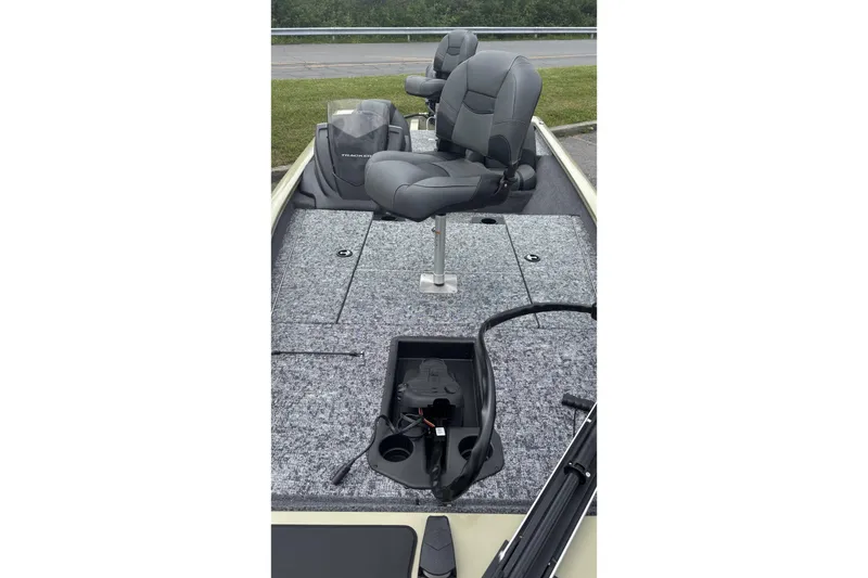 Slide: The Image of 2026 Tracker Bass Tracker Classic Limited boat interior with gray seating and storage compartments. - 3