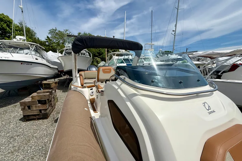 Slide: The Image of 2024 Zodiac Medline 9 boat with sleek design, docked among other vessels. - 13