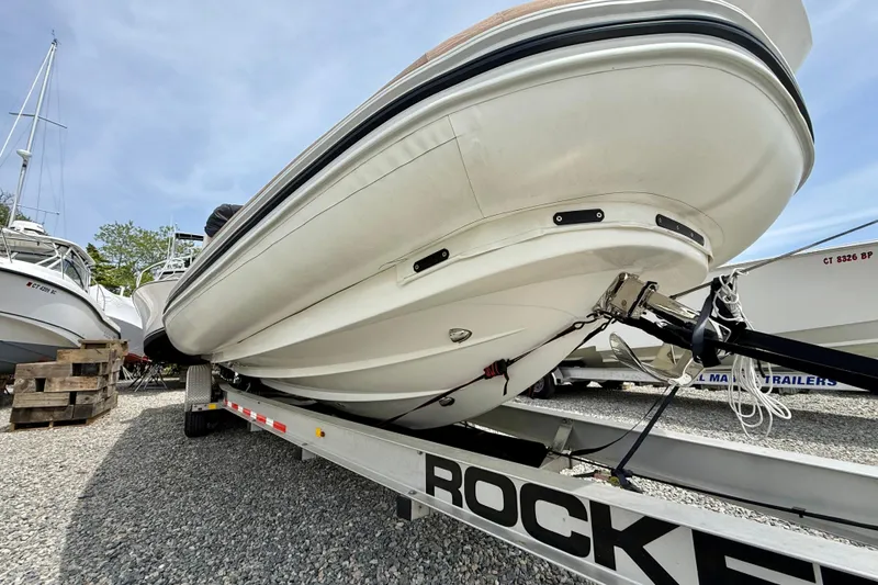 Slide: The Image of 2024 Zodiac Medline 9 boat on trailer, viewed from below, showcasing hull design. - 3