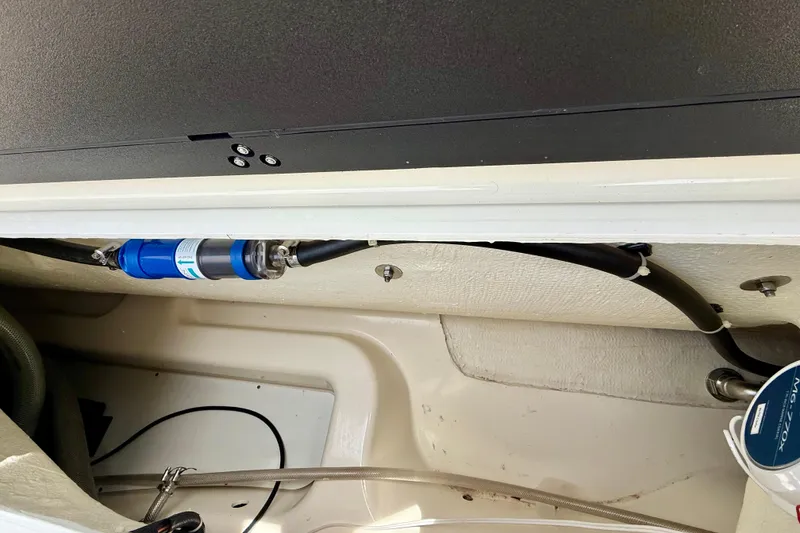 Slide: The Image of 2024 Zodiac Medline 9 boat interior showing plumbing and wiring components. - 31