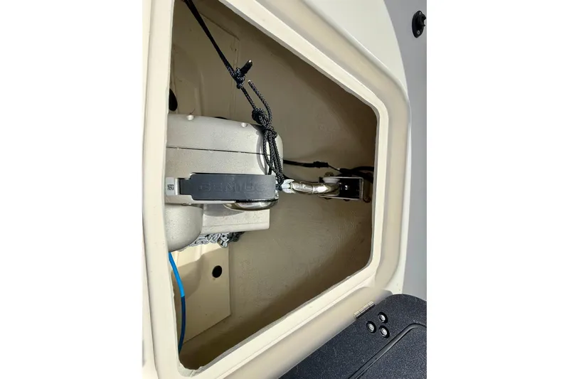 Slide: The Image of 2024 Zodiac Medline 9 storage compartment with secured equipment and wiring. - 32