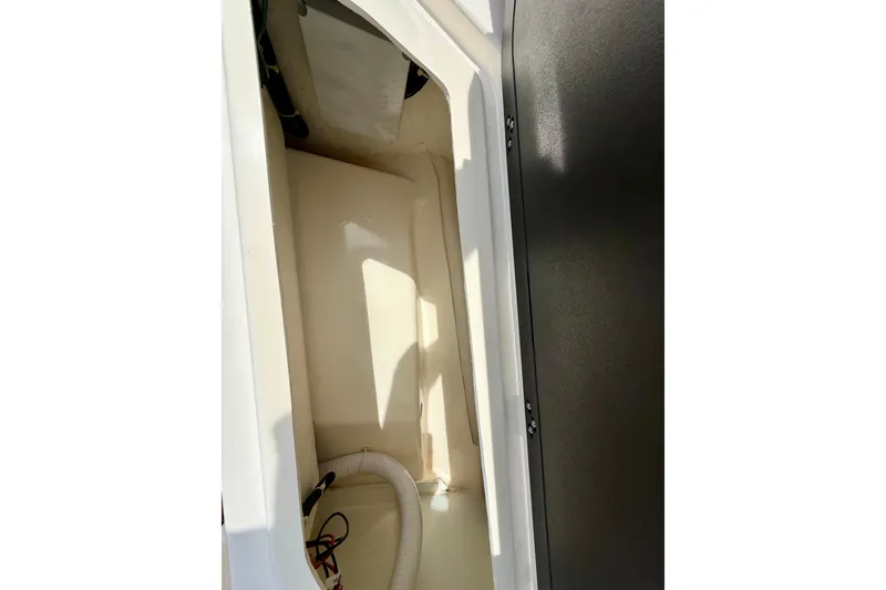 Slide: The Image of Interior storage compartment of 2024 Zodiac Medline 9 boat, featuring clean design and wiring. - 34