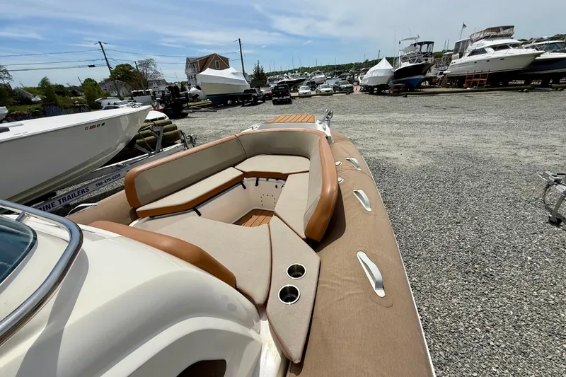 Slide: The Image of 2024 Zodiac Medline 9 boat with beige seating, docked in a marina. - 5
