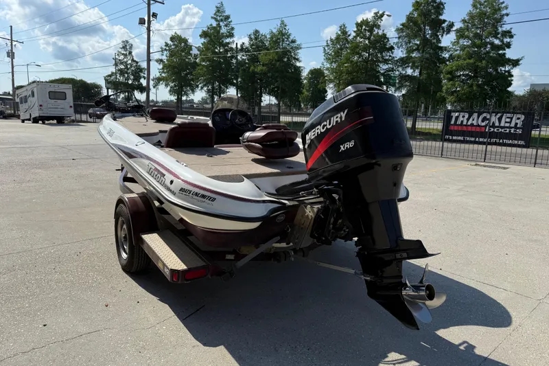 Slide: The Image of 2001 Triton Tr-186 boat with Mercury XR6 engine on trailer in outdoor setting. - 5