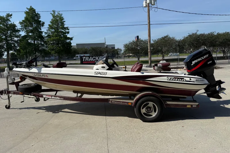 Slide: The Image of 2001 Triton Tr-186 boat with Mercury XR6 engine on trailer. - 6