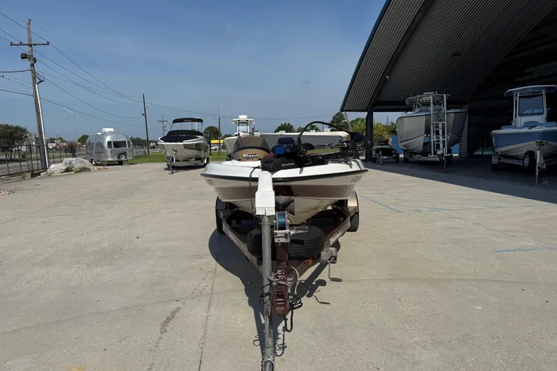 Slide: The Image of 2001 Triton Tr-186 boat on trailer in outdoor storage area. - 8