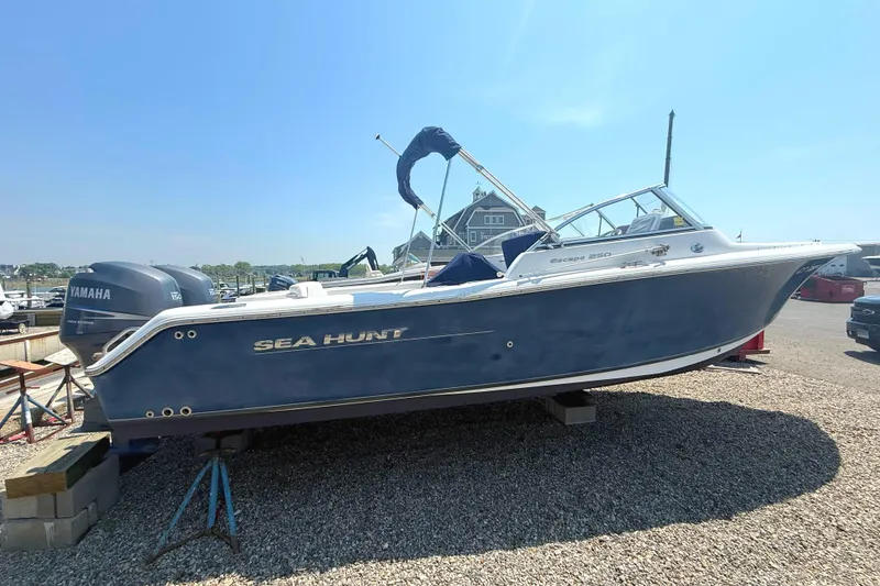 The Image of 2012 Sea Hunt Escape 250 boat on gravel lot. - 0
