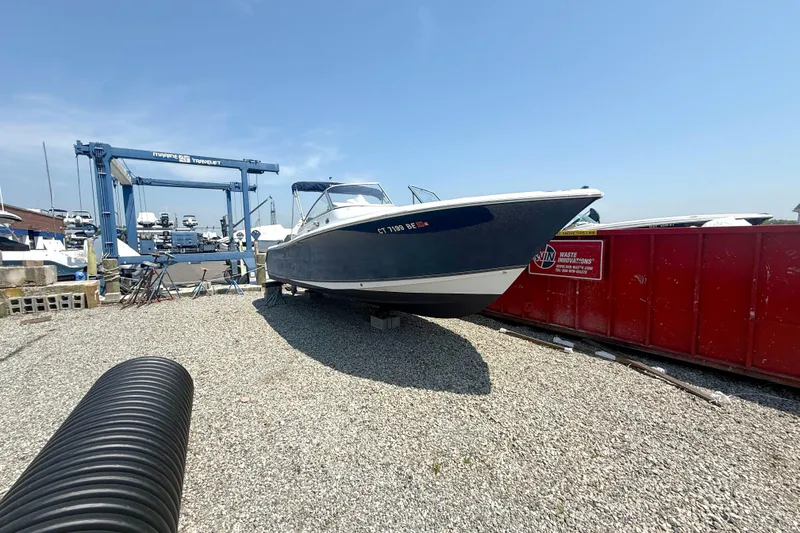 Slide: The Image of 2012 Sea Hunt Escape 250 boat on gravel lot. - 1