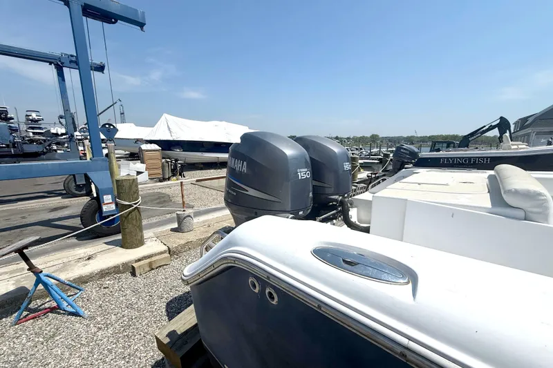 Slide: The Image of 2012 Sea Hunt Escape 250 with Yamaha engines at the dock. - 12