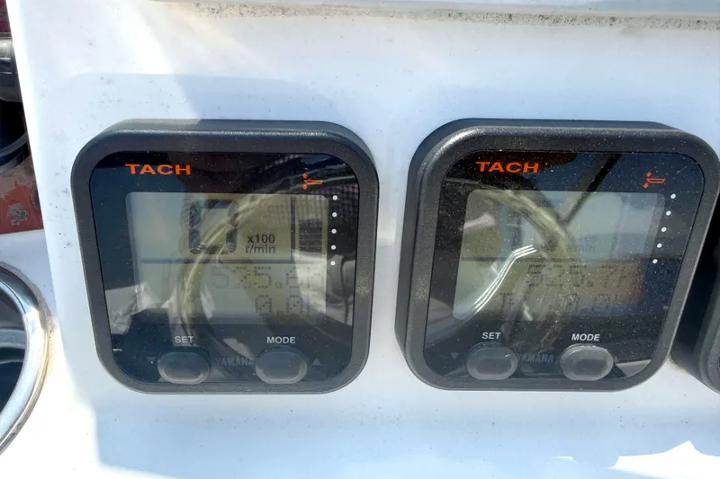 Slide: The Image of Tachometer displays on a 2012 Sea Hunt Escape 250 boat. - 13