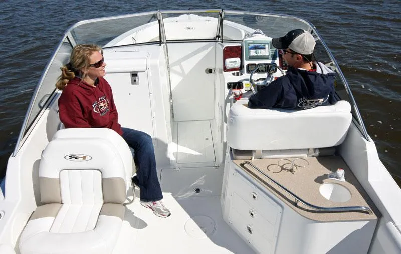 Slide: The Image of Two people on a 2012 Sea Hunt Escape 250 boat. - 14