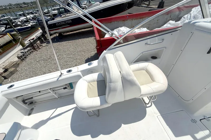 Slide: The Image of Interior view of a 2012 Sea Hunt Escape 250 boat with white seats. - 5