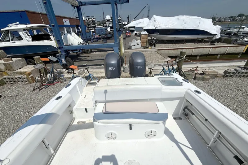 Slide: The Image of 2012 Sea Hunt Escape 250 boat in harbor with engines. - 7