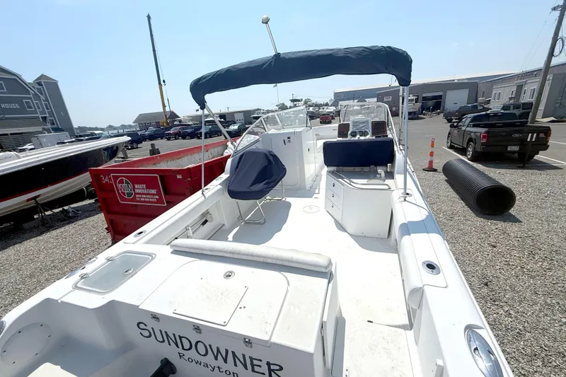 Slide: The Image of 2012 Sea Hunt Escape 250 boat docked at marina. - 8
