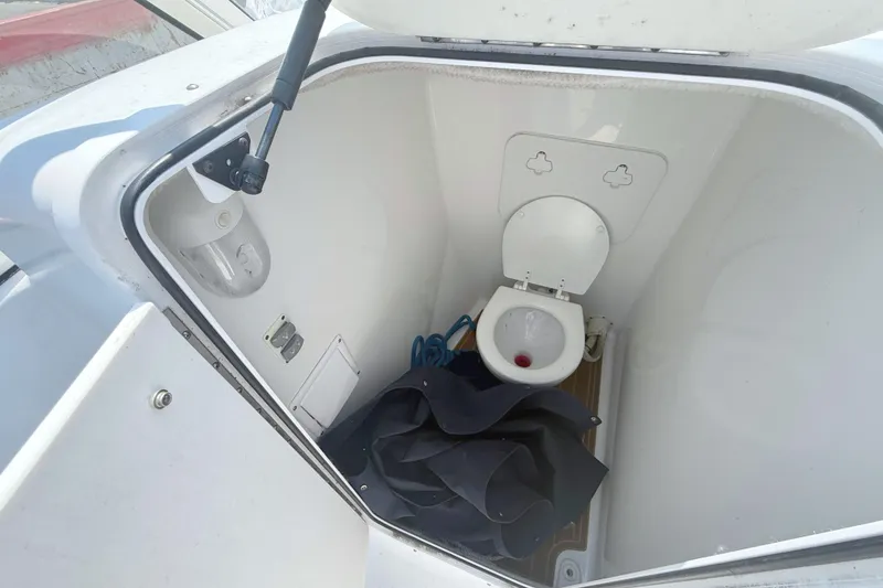 Slide: The Image of Interior of a 2012 Sea Hunt Escape 250 with toilet. - 9