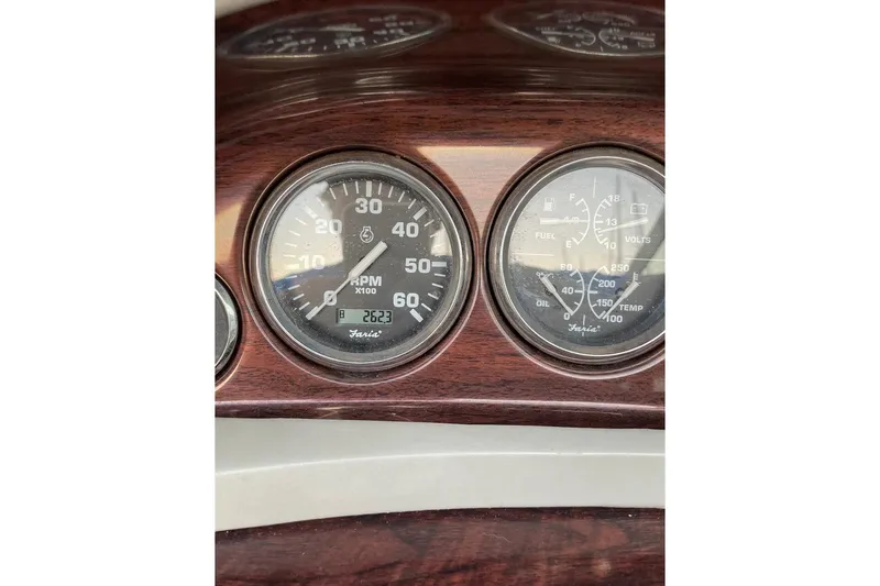 Slide: The Image of Dashboard gauges of a 1999 Four Winns 180 Horizon boat. - 3