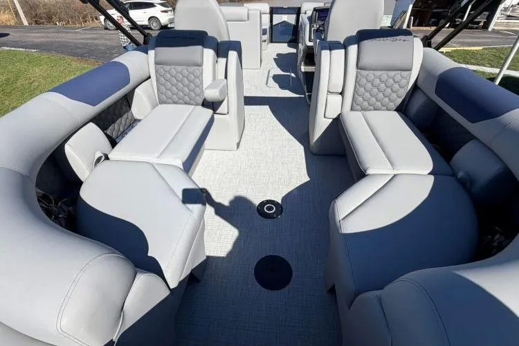 Slide: The Image of Luxurious interior of 2026 South Bay 523RS pontoon boat with plush seating. - 3