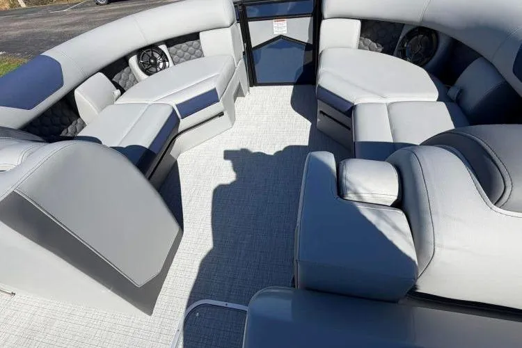 Slide: The Image of Luxurious interior of 2026 South Bay 523RS pontoon boat with plush seating. - 4