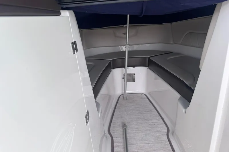 Slide: The Image of Interior cabin of 2021 Chaparral 237 SSX boat with seating and storage. - 16