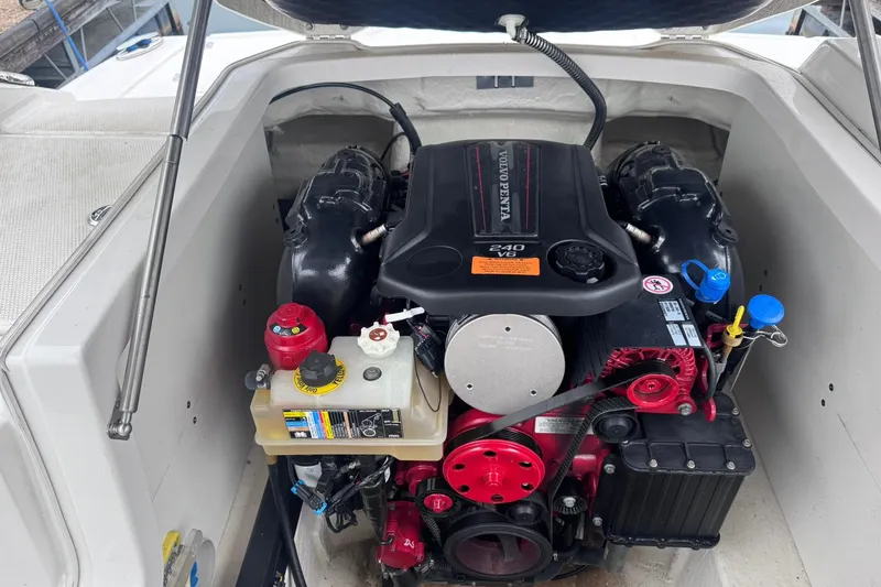 Slide: The Image of Engine compartment of a 2021 Chaparral 237 SSX boat featuring a Volvo Penta 240 V6 engine. - 18