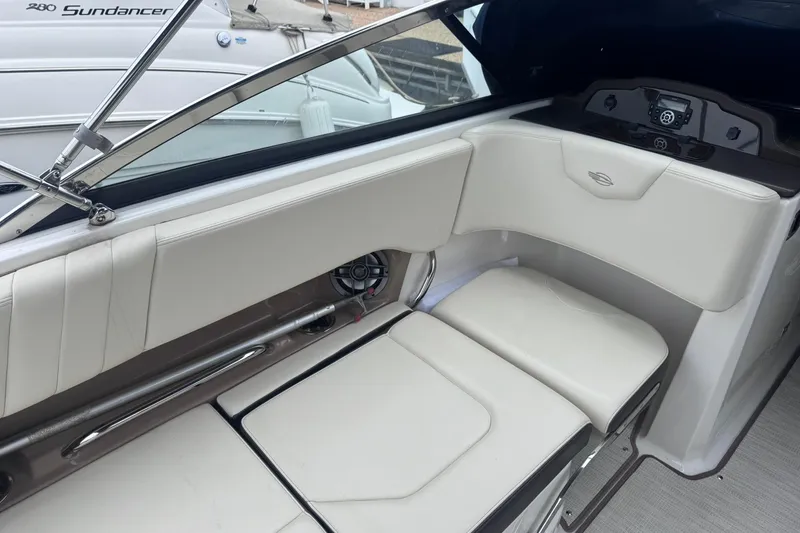 Slide: The Image of Interior seating of a 2021 Chaparral 237 SSX boat, featuring white upholstery and sleek design. - 7