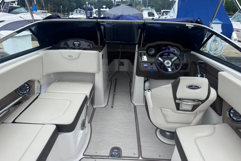 Slide: The Image of Interior of a 2021 Chaparral 237 SSX boat with luxurious seating and modern dashboard. - 9