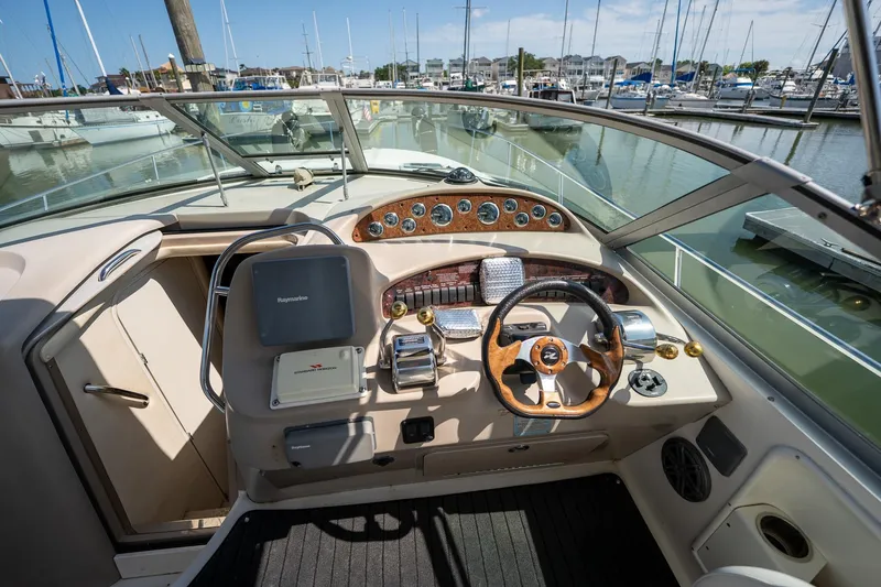Slide: The Image of Cockpit view of 2000 Sea Ray 340 Sundancer yacht at marina. - 11