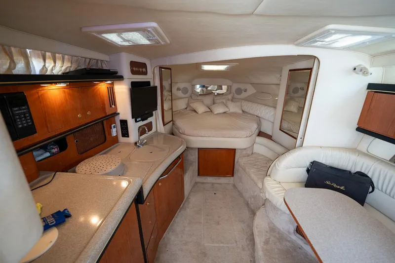 Slide: The Image of Luxurious interior of a 2000 Sea Ray 340 Sundancer yacht with cozy seating and modern amenities. - 15