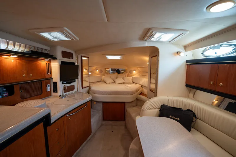 Slide: The Image of Luxurious interior of a 2000 Sea Ray 340 Sundancer yacht with cozy seating and modern amenities. - 19