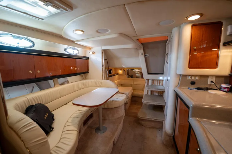 Slide: The Image of Interior of 2000 Sea Ray 340 Sundancer yacht with cozy seating and modern amenities. - 23