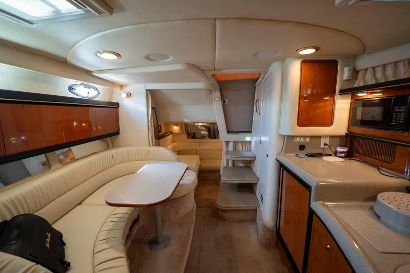Slide: The Image of Luxurious interior of a 2000 Sea Ray 340 Sundancer yacht with modern amenities. - 25