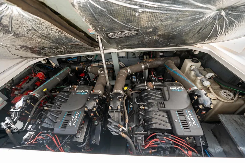 Slide: The Image of Engine compartment of a 2000 Sea Ray 340 Sundancer with twin MerCruiser engines. - 30
