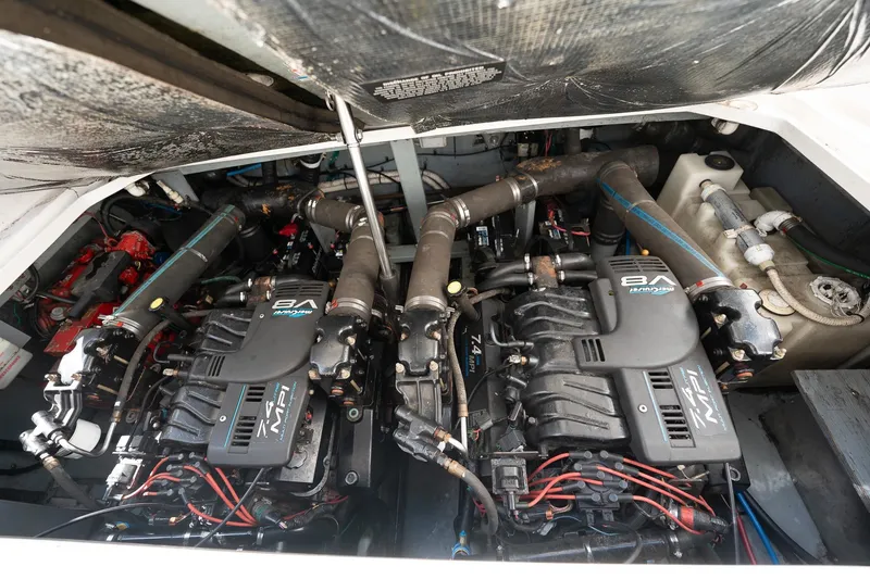 Slide: The Image of Engine compartment of a 2000 Sea Ray 340 Sundancer with twin MerCruiser V8 engines. - 31