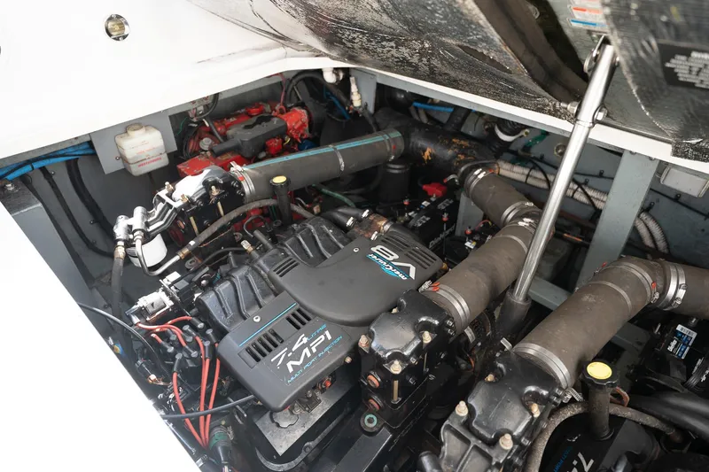 Slide: The Image of Engine compartment of a 2000 Sea Ray 340 Sundancer, featuring a MerCruiser 7.4L MPI V8 engine. - 35