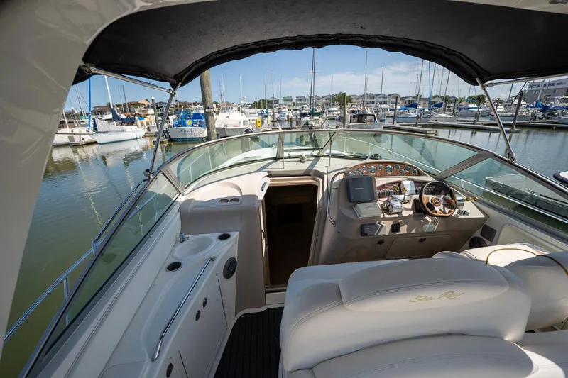 Slide: The Image of Cockpit view of 2000 Sea Ray 340 Sundancer yacht docked at marina. - 9