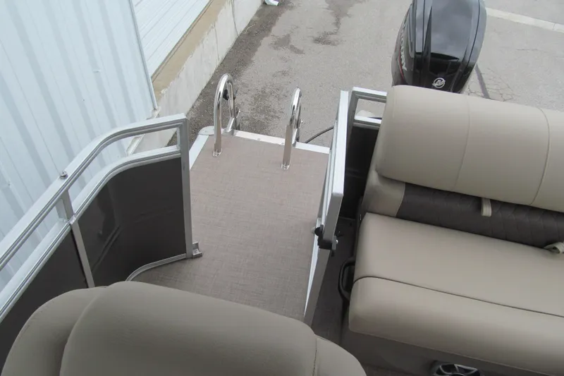 Slide: The Image of 2024 Sun Tracker Party Barge 20 DLX pontoon boat with comfortable seating and rear entry ladder. - 11