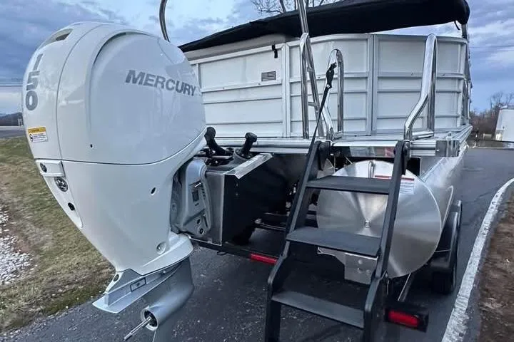 Slide: The Image of 2026 South Bay 222CR LE pontoon boat with Mercury outboard motor, rear view. - 3