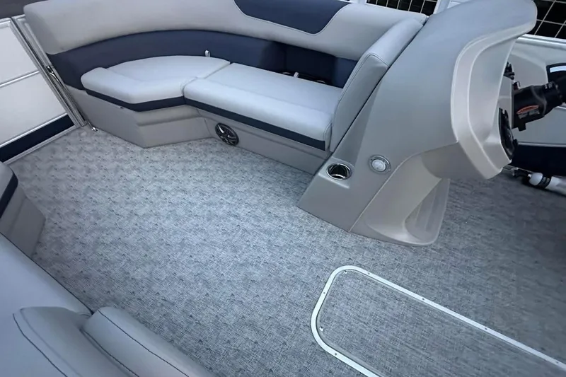 Slide: The Image of Interior of 2026 South Bay 222CR LE pontoon boat with gray seating and carpet. - 4