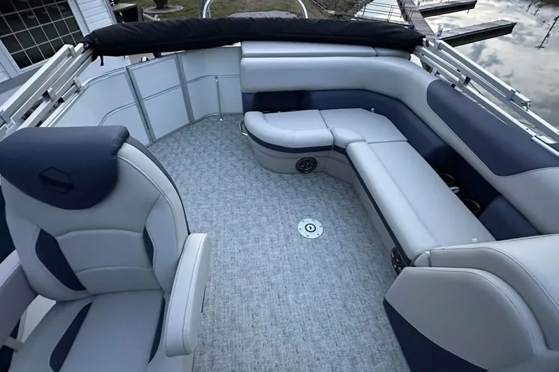 Slide: The Image of Luxurious interior of 2026 South Bay 222CR LE pontoon boat with plush seating. - 5